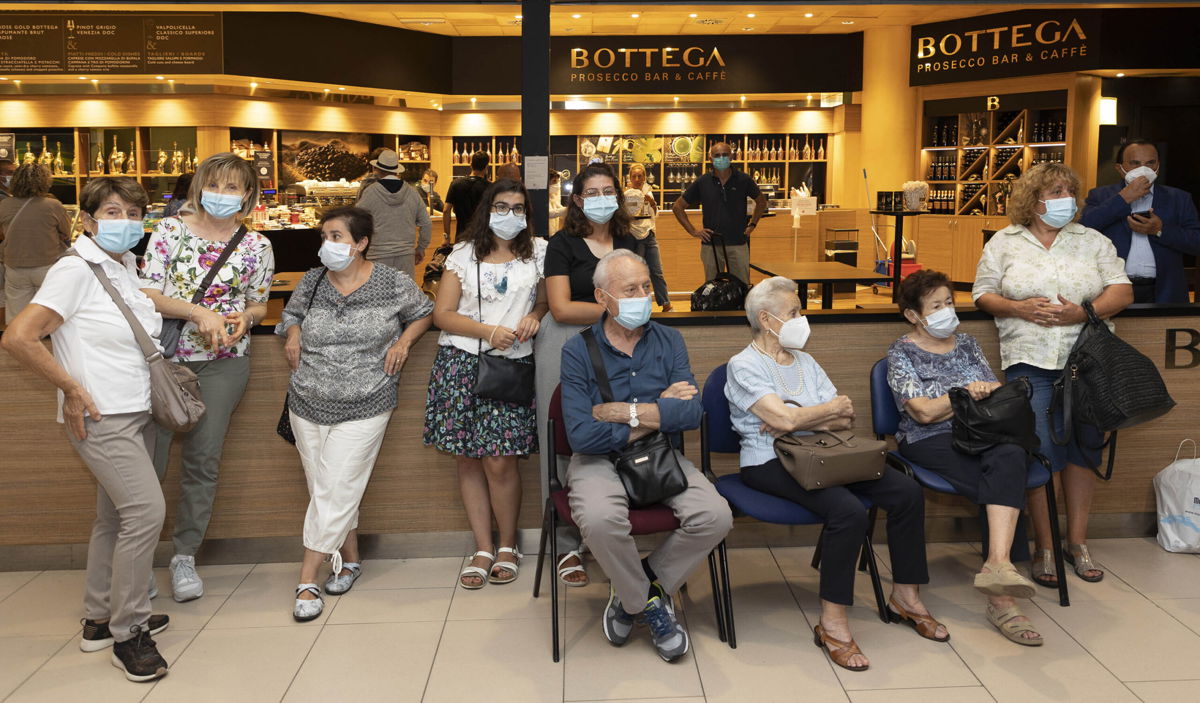 <i>Courtesy Gino Rosa</i><br/>Members of the Naldi family wait to meet Adler at Bologna's airport.