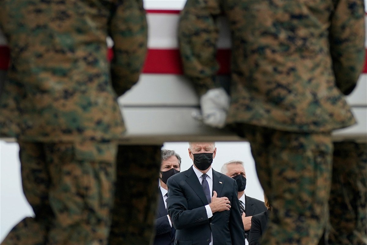 <i>Carolyn Kaster/AP</i><br/>President Joe Biden is slated to address the nation Tuesday on the end of the war in Afghanistan. Biden here watches stoically as the remains of American service members killed in Afghanistan returned Sunday to the United States.