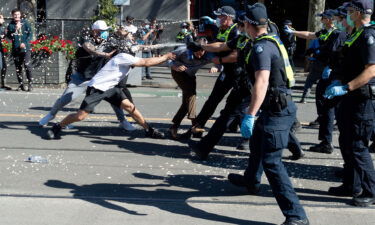 Police deploy capsicum spray on protesters in Melbourne.