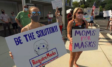 The protests come a day after fifth graders at East Side Elementary in Cobb County were sent home because of high numbers of Covid-19 cases