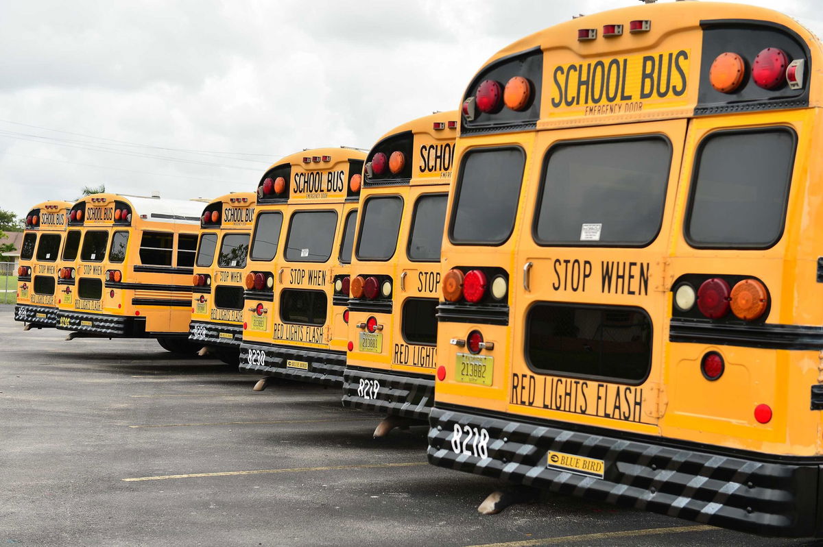 <i>Johnny Louis/Getty Images</i><br/>A fleet of Broward County School buses are parked in a lot on July 21