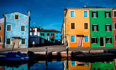 Canalside houses on Burano island in Venice Lagoon.
