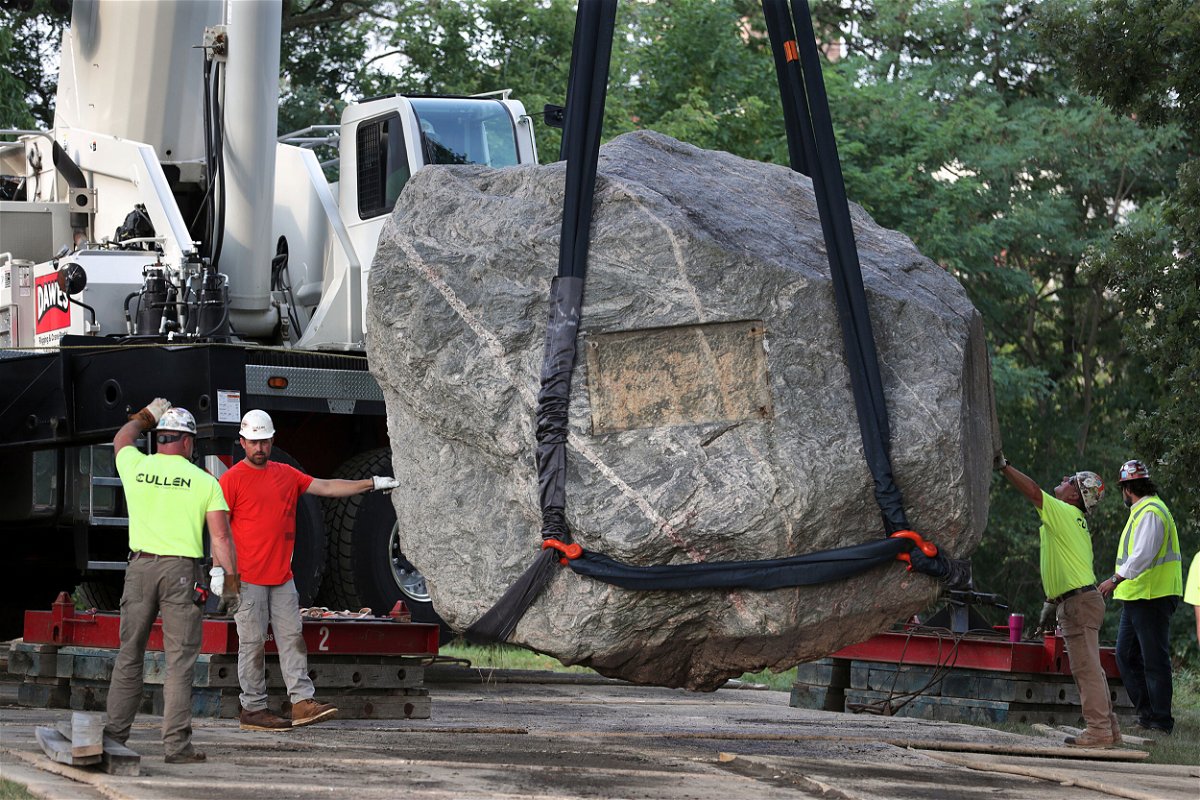 <i>Kayla Wolf/Wisconsin State Journal/AP</i><br/>Crews work to remove Chamberlin Rock from Observatory Hill on the University of Wisconsin campus in Madison on Friday.
