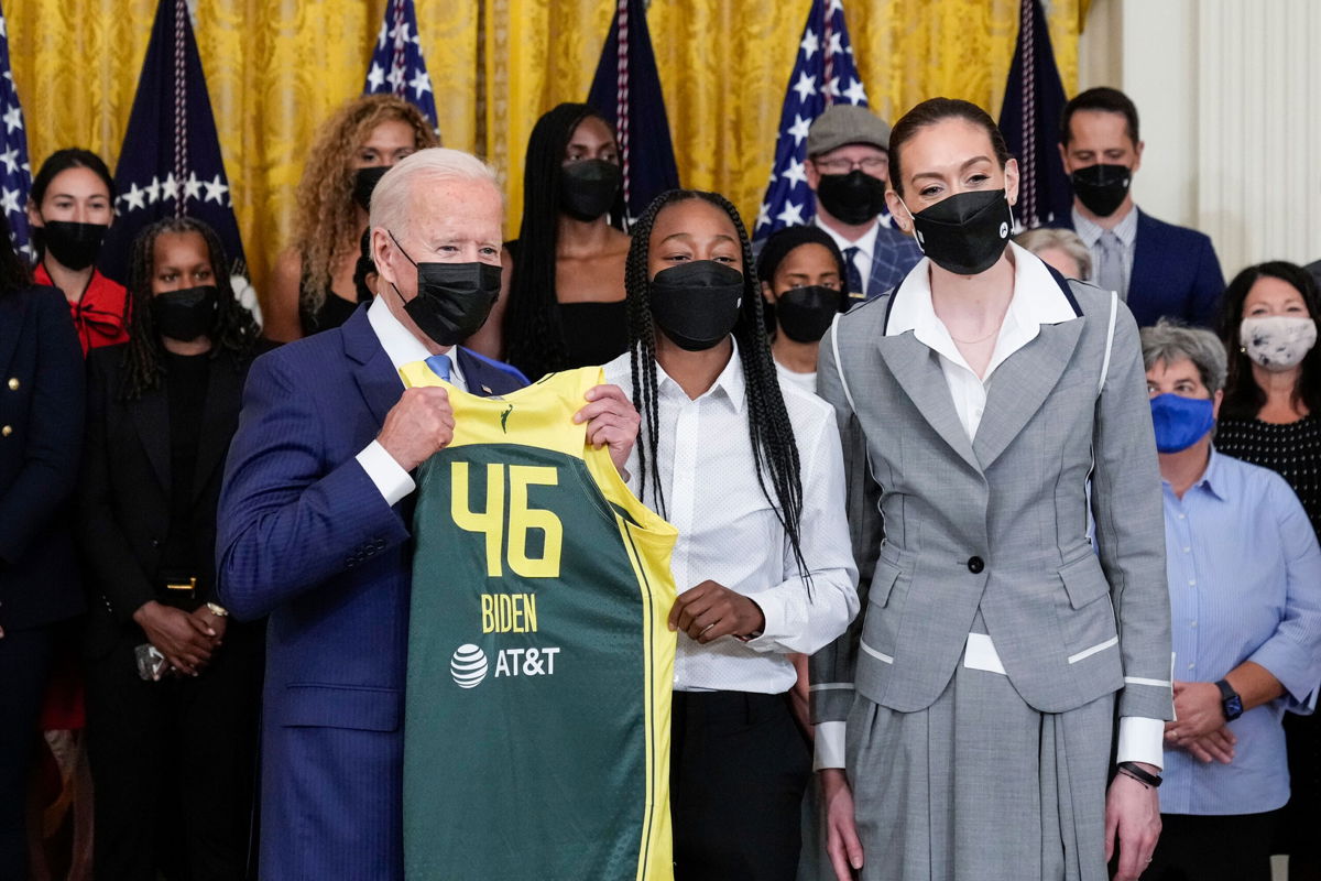 <i>Drew Angerer/Getty Images</i><br/>President Joe Biden accepts a jersey on Monday