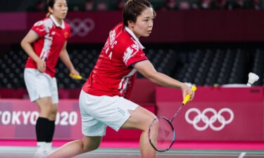 Chen Qingchen and Jia Yifan of China compete during the badminton women's doubles gold medal match in the Tokyo 2020 Olympic Games.