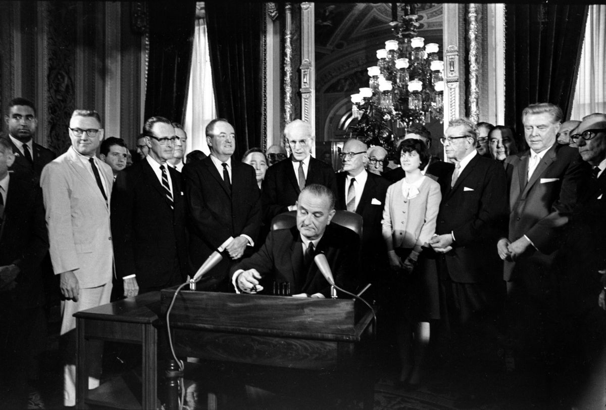 <i>Associated Press</i><br/>President Lyndon B. Johnson signs the Voting Rights Act of 1965 in a ceremony in the President's Room near the Senate chambers in Washington