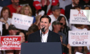 Arizona Gov. Doug Ducey speaks during a rally for President Donald Trump at the International Air Response facility on October 19