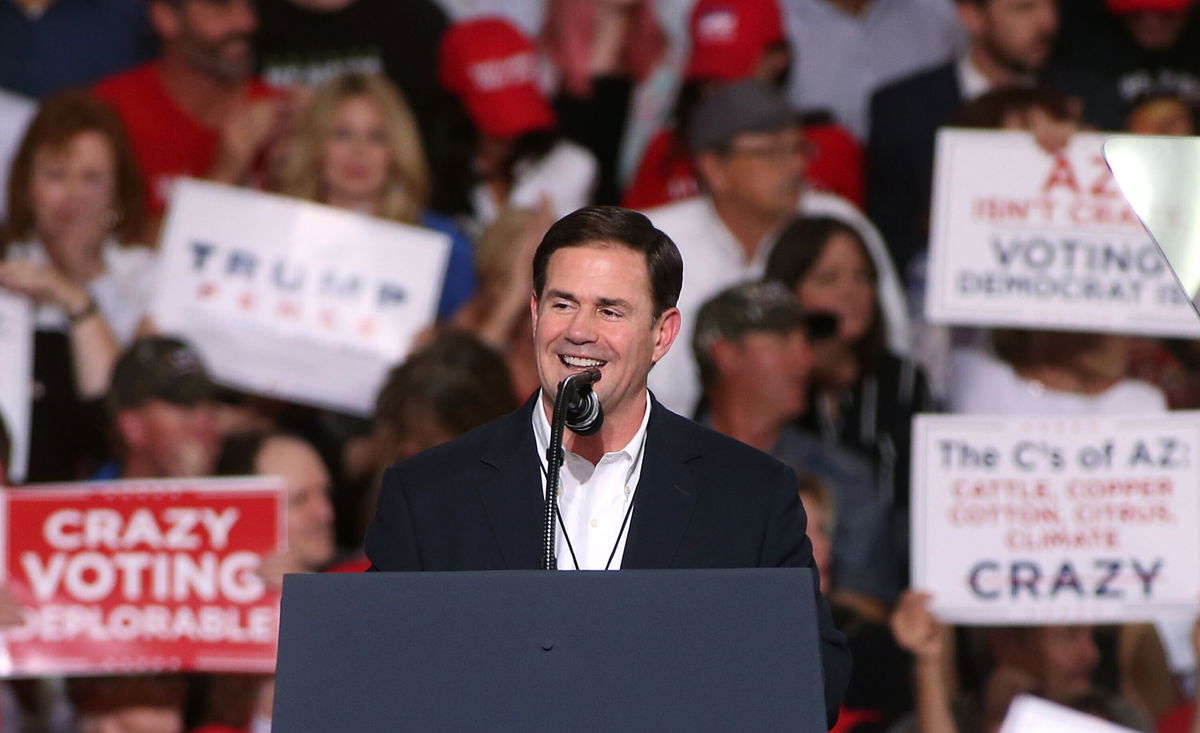 <i>Ralph Freso/Getty Images</i><br/>Arizona Gov. Doug Ducey speaks during a rally for President Donald Trump at the International Air Response facility on October 19