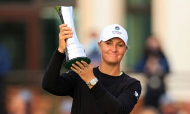 Anna Nordqvist of Sweden lifts the AIG Women's Open trophy on August 22.