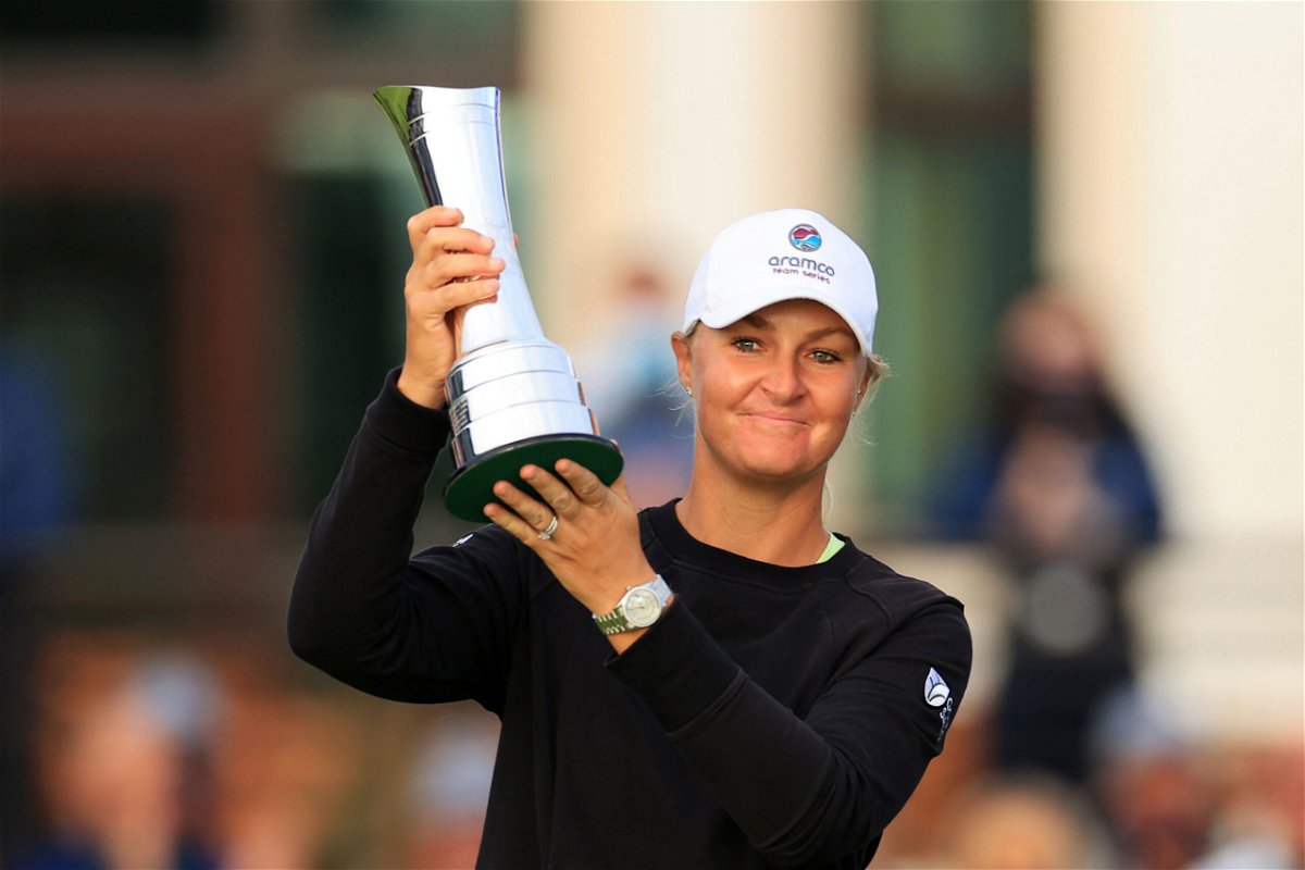 <i>David Cannon/R&A/Getty Images</i><br/>Anna Nordqvist of Sweden lifts the AIG Women's Open trophy on August 22.