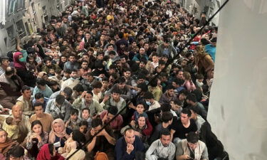 Afghan evacuees crowd the interior of a U.S. Air Force C-17 transport aircraft on its way from Kabul to Qatar on August 15.