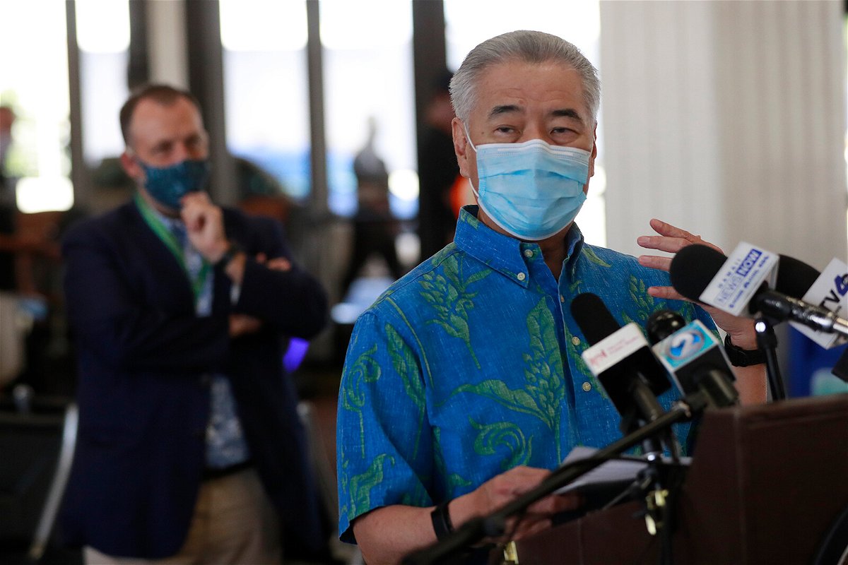 <i>Marco Garcia/AP</i><br/>Hawaii Gov. David Ige asked tourists to voluntarily stay away from the state amid a record surge in Covid-19 cases and hospitalizations. Ige is seen here in Honolulu