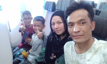 Shirzad and his family on the plane from Kabul to Bahrain on August 24.