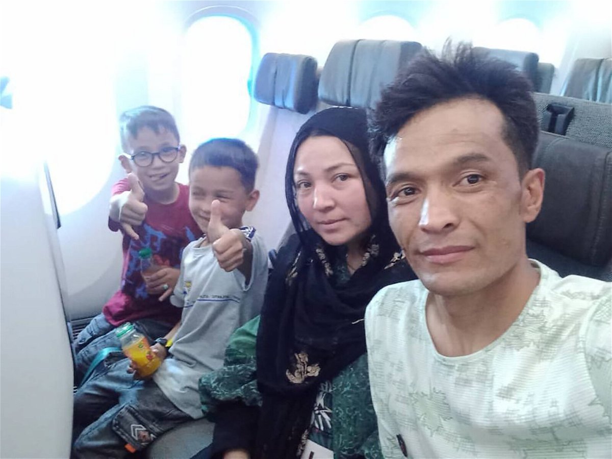 <i>Courtesy Abdul Rashid Shirzad</i><br/>Shirzad and his family on the plane from Kabul to Bahrain on August 24.