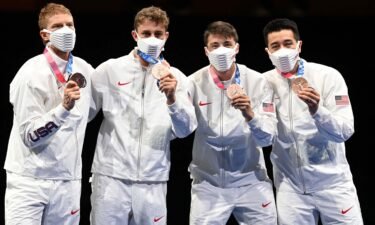 Race Imboden and his US teammates pose with their bronze medals at the 2020 Summer Olympics in Tokyo