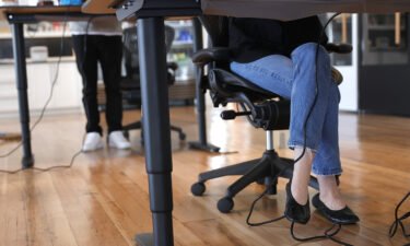 Employees at tech startup company Fast work at their desks in the office on March 24