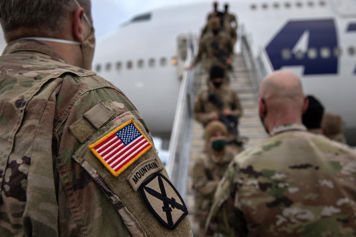 <i>John Moore/Getty Images</i><br/>The Pentagon is mandating that US military service members get fully vaccinated against Covid-19 immediately. U.S. Army soldiers here return home from Afghanistan on December 10