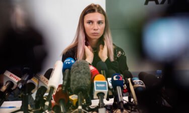 Two Belarusian Olympic officials who allegedly tried to force sprinter Kristina Timanovskaya onto plane are stripped of accreditation. Timanovskaya is seen here during a press conference in Warsaw