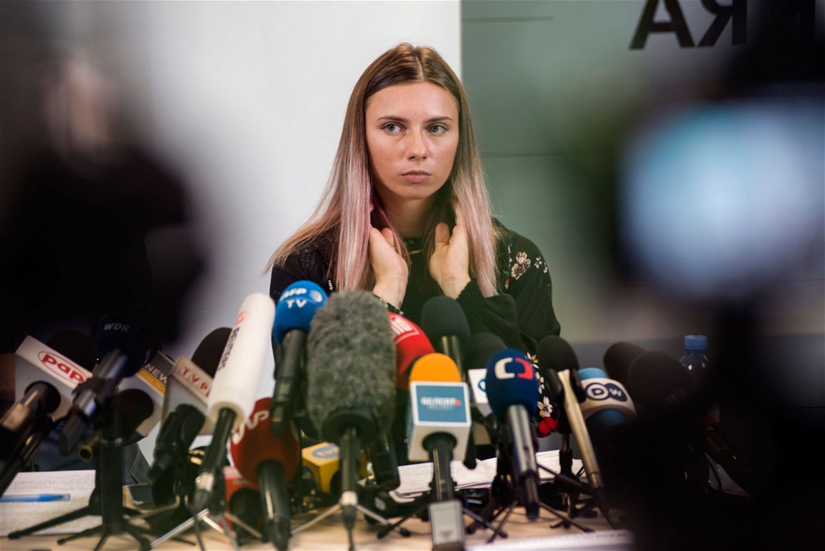 <i>Attila Husejnow/SOPA Images/Sipa USA/AP</i><br/>Two Belarusian Olympic officials who allegedly tried to force sprinter Kristina Timanovskaya onto plane are stripped of accreditation. Timanovskaya is seen here during a press conference in Warsaw