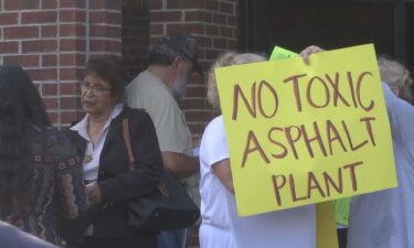 Residents concerned over public health risks of a proposed asphalt plant rallied in a Flint neighborhood on Sept. 1.