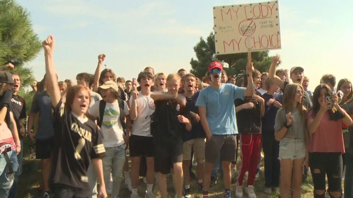 <i>KCNC</i><br/>Dozens of students protested outside ThunderRidge High School in Highlands Ranch on Sept. 1 over a mask mandate.