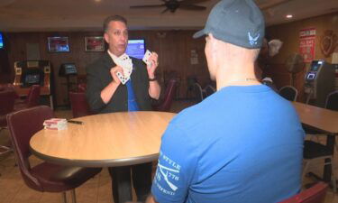 Chris Rose travels overseas and performs magic tricks for troops.
