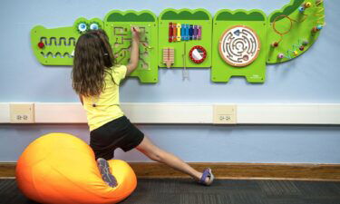 Seven-year-old Avery Walls plays with a fidget board in the new sensory room at Weeping Water Elementary School.
