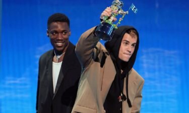 Giveon and Justin Bieber accept the award for Best Pop. Bieber was also awarded Artist of the Year.