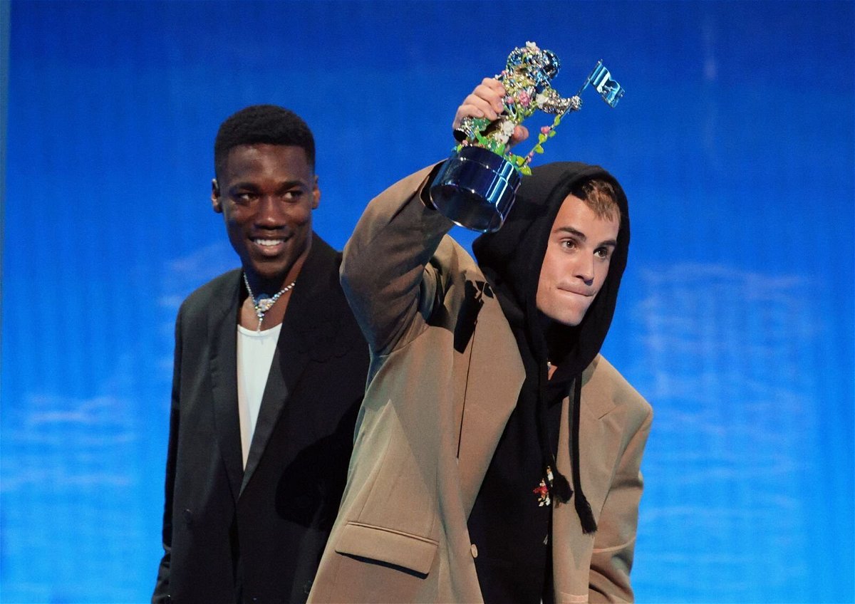 <i>Theo Wargo/Getty Images</i><br/>Giveon and Justin Bieber accept the award for Best Pop. Bieber was also awarded Artist of the Year.