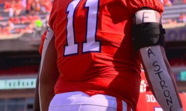 Clemson defensive tackle Bryan Bresee writes Ella Strong on his arms for every game to pay homage to his sister battling brain cancer.