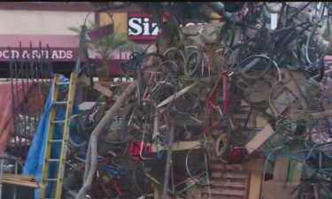 A large wall of bicycles created by a local homeless man is bringing attention to homelessness.