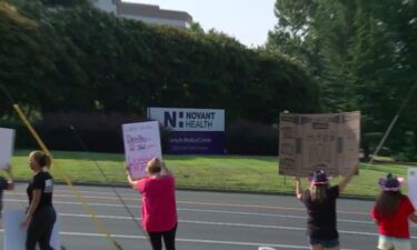 Healthcare workers protest vaccine mandate outside Novant Health Forsyth Medical Center in Winston-Salem