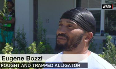 Eugene Bozzi lured an alligator inside a garbage can on Tuesday.