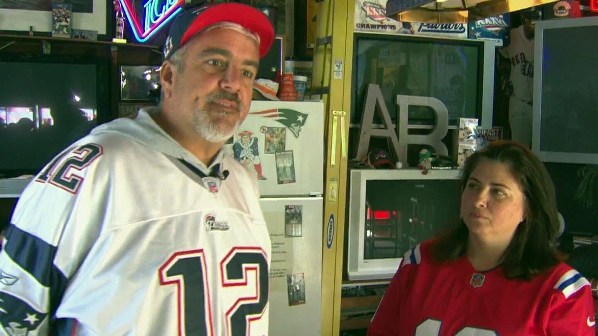 <i>WBZ</i><br/>It appears to be a house divided for a Watertown couple. Mark Pettiglio wears his No. 12 while his wife