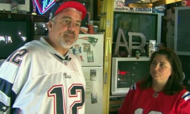 It appears to be a house divided for a Watertown couple. Mark Pettiglio wears his No. 12 while his wife