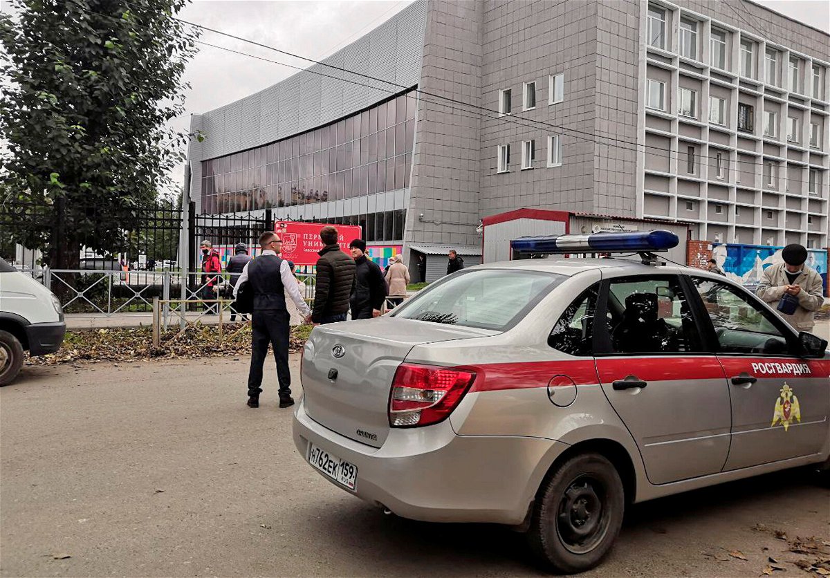 <i>Anna Vikhareva/Reuters</i><br/>A national guard car parked at the Perm State University after a gunman opened fire on Monday.