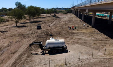 Crews clear an area used by migrants