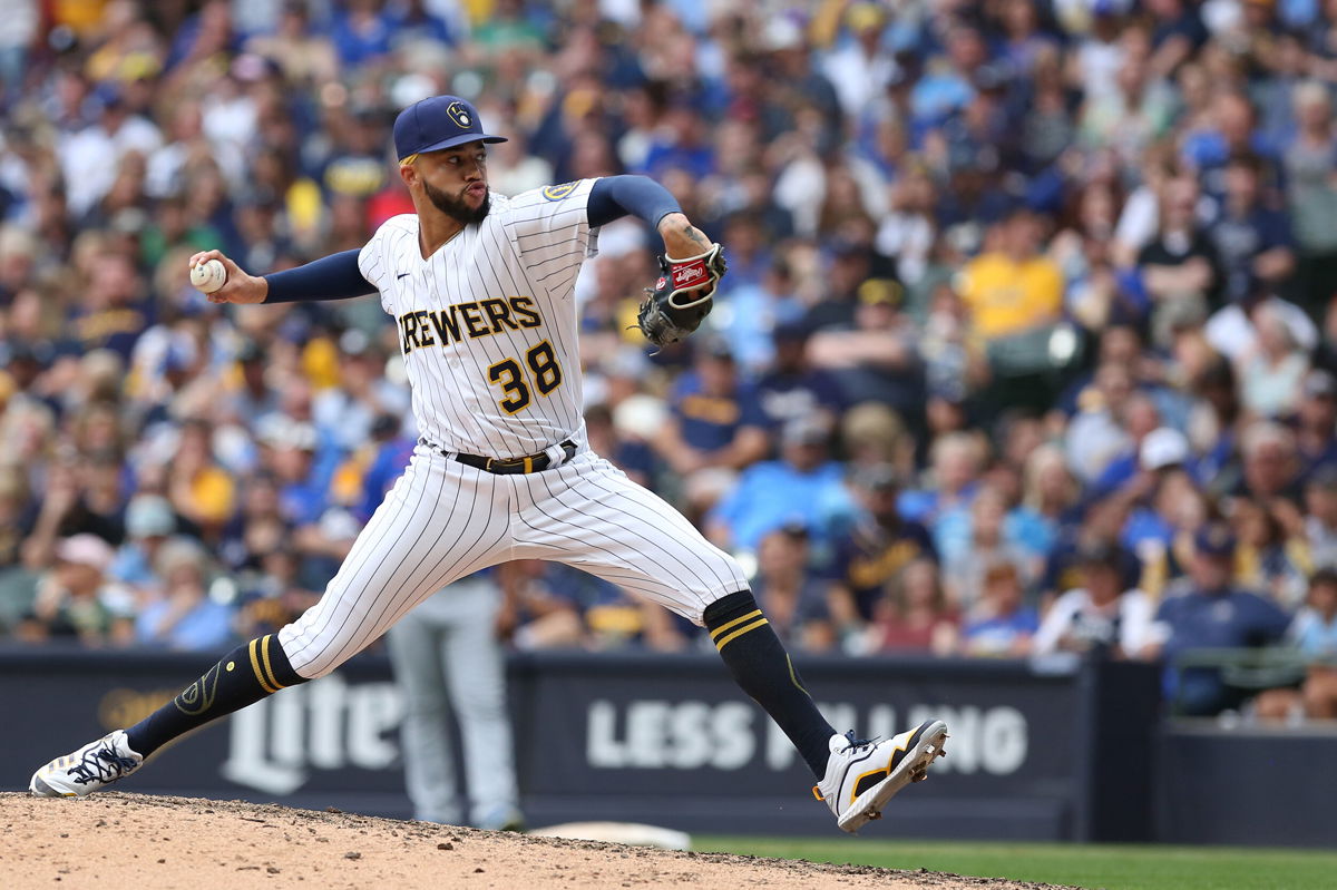 <i>Larry Radloff/Icon Sportswire/Getty Images</i><br/>Milwaukee Brewers relief pitcher Devin Williams pitches against the New York Mets on Sunday.