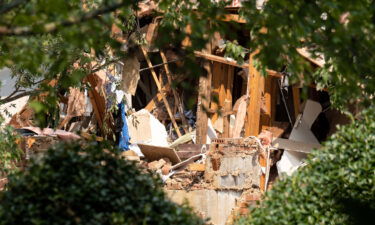 A explosion at an apartment complex north of Atlanta injured four people and destroyed several floors of a building.