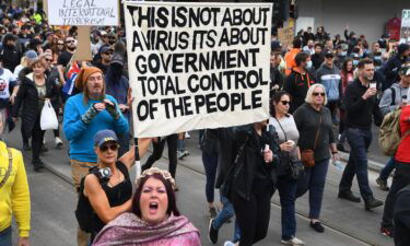 Protesters march through the streets during an anti-lockdown rally in Melbourne on Sept. 18.