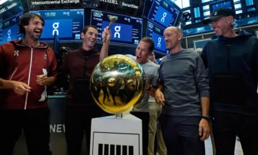 On executives ring a ceremonial first trade bell as their company's IPO begins trading on the floor of the New York Stock Exchange