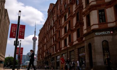 The Delta variant has hit China's economy hard. Now a property crunch is looming. Pictured is a shopping street in Shanghai