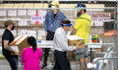 Former Secretary of State Ken Bennett works to move ballots from the 2020 general election at Veterans Memorial Coliseum on May 1