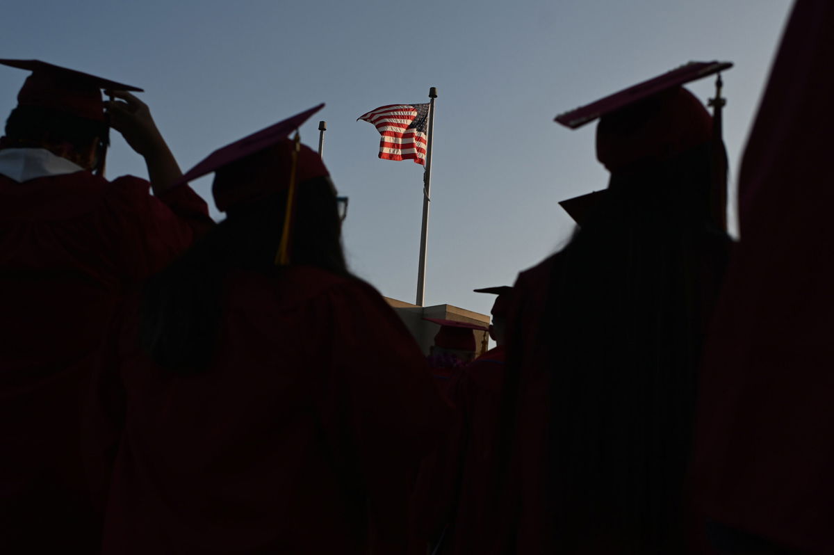 <i>Robyn Beck/AFP/Getty Images</i><br/>Navient is quitting the federal student loan business. Students at Pasadena City College here participate in the graduation ceremony