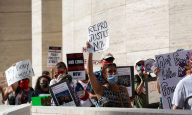 Protestors march from City Hall to the federal court house in protest of the new state abortion ban in Houston