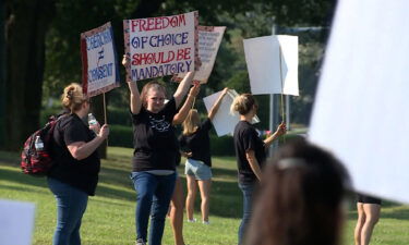Dozens of health care workers protested Novant Health's vaccine mandate for employees outside of Forsyth Medical Center in Winston-Salem