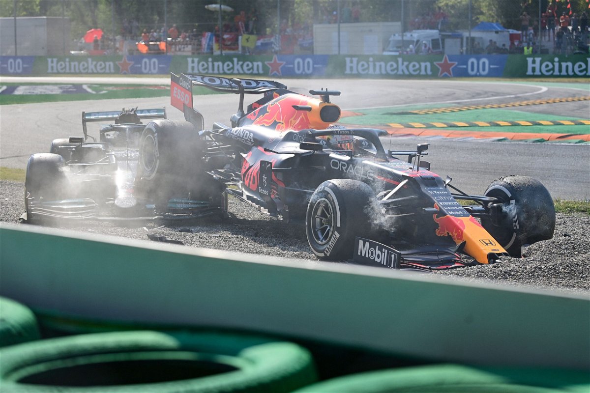 <i>ANDREJ ISAKOVIC/AFP/AFP via Getty Images</i><br/>Verstappen and Hamilton collide during the Italian Formula One Grand Prix on September 12.