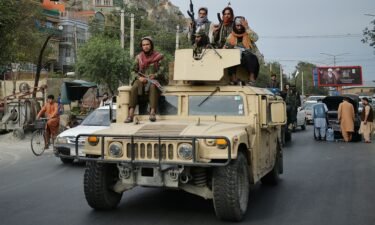 The Taliban have announced Tuesday the formation of a hardline interim government for Afghanistan. Taliban fighters atop a Humvee vehicle are seen here in Kabul on August 31.