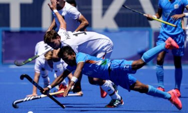 India and Germany's hockey teams compete during the men's hockey bronze medal match.