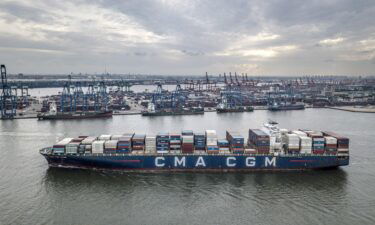 China's trade hit record levels last month despite the global shipping crisis. A CMA CGM container ship here departs Tianjin Port in Tianjin